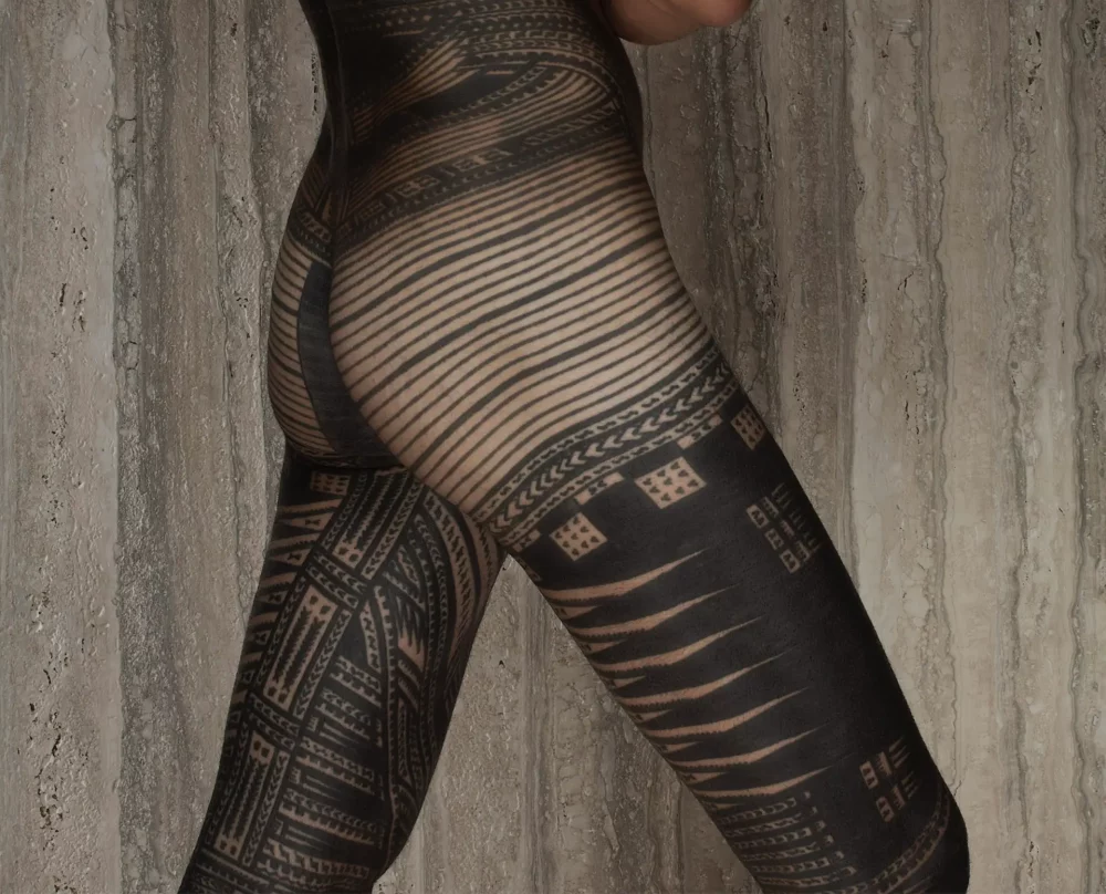 Close up of person covered in tattoos